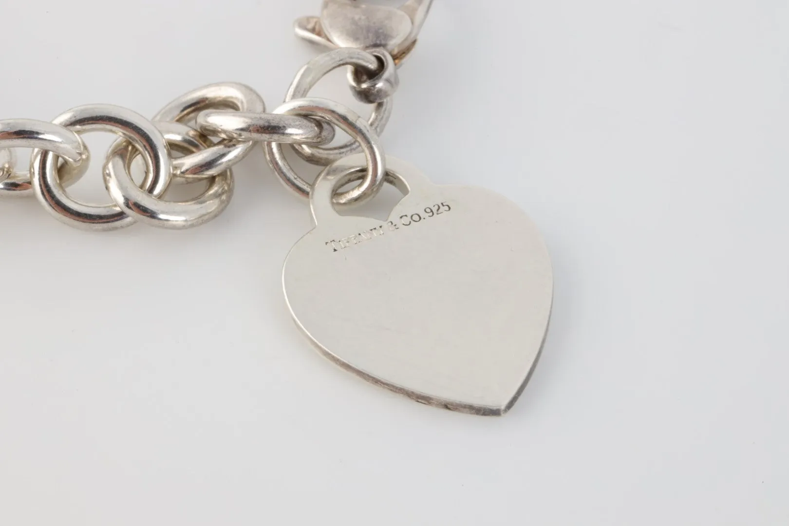 7.5" Tiffany & Co. 925 Silver Bracelet with Heart Charm (34.57g.)