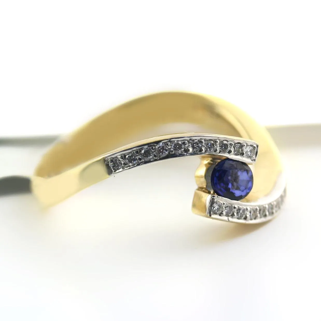 Blue Sapphire and Diamond Twist Band Ring Yellow Gold